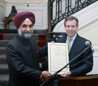 Mark  Brunner, Senior Advisor to Senator Mark Warner, presenting to Charge d\'  Affaires, Taranjit Singh Sandhu the "Senate Resolution on Diwali".  In a  reflection of the importance attached to the India-U.S. relations, and  to the Indian-American community and the celebration of Diwali, the  United States Senate passed a unanimous resolution on November 4, 2013  "Recognizing the religious and historical significance of the festival  of Diwali". The Resolution was sponsored by the Co-Chair of Senate India  Caucus and a steadfast champion of India-U.S. relations, Senator Mark  Warner of Virginia.