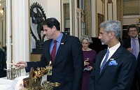Ambassador Ron Dermer, Israel's Ambassador to the U.S., lighting the Menorah, the traditional oil lamp, on the occasion.