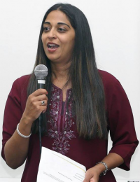 Ms. Aastha Verma performing the emcee for the event â€œListen and See Buddha - A Talk by Prof. Robert DeCaroli and â€˜Chandalikaâ€™ - Dance Ballet by Kuchipudi Dance Academy, hosted by the Embassy on May 8.