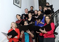 Singing of Christmas carols by Choir group from St. Alban's Episcopal Church, led by Ms. Sonya Sutton.