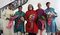 Artists of 'Raag, Rhythm and Repartee: A Musical Evening of 'Jugalbandi' presentation (from left to right) Vijay Ganesh, H.N. Bhaskar, Pandit Vishwa Mohan Bhatt, Sowmiya Narayanan and Krishna Ramdas after being presented with bouquets by Minister Sridharan Madhusudhanan.