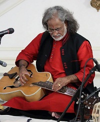 Pandit Vishwa Mohan Bhatt on Mohana Veena during the cultural event of 'Raag, Rhythm and Repartee: A Musical Evening of 'Jugalbandi', presented by Embassy of India, Washington DC on April 6.