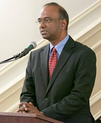 Minister Sridharan Madhusudhanan welcoming the guests at the Film Screening and Discussion event "'Awake: The Life of Yoganand' - A Film on the Life of Paramahansa Yogananda", presented by the Embassy of India, Washington DC on June 21, as part of the International Day of Yoga Celebrations.