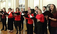 Singing of Christmas carols by Choir group from St. Alban's Episcopal Church, Washington DC, led by Ms. Sonya Sutton, Director of music (Organist and Choirmaster).