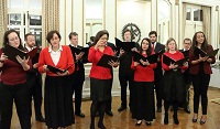 Singing of Christmas carols by Choir group from St. Alban's Episcopal Church, Washington DC, led by Ms. Sonya Sutton, Director of music (Organist and Choirmaster).