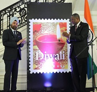 Unveiling of Diwali Stamp by Ambassador Navtej Sarna and Mr. Ronald A. Stroman, US Deputy Postmaster General at the Diwali Celebration and Diwali Forever Stamp Dedication event hosted by the Embassy of India, Washington, DC, on November 18.