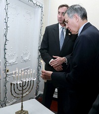 Lighting the Menorah, the traditional oil lamp, on the occasion.