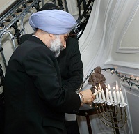 Lighting the Menorah, the traditional oil lamp, on the occasion.