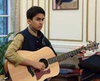Master Tej Kanitkar playing the Guitar at the 'Eid-ul-Fitr' celebrations hosted at the Embassy Residence on July 31, 2016.