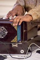 Presentation of 'Harmony- a Musical Offering of Ghazals and Bhajans on the Eve of Birth Anniversary of Gandhiji'' by Sudhir Narain (vocal & Harmonium).