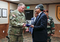 Ambassador Arun K. Singh presenting a Memento to the Commander US Special Forces during the Indo - US Special Forces Exercise Vajra Prahar at Joint Base Lewis McChord