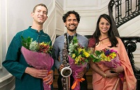 Artists of "'New World Raga' - Communicating Across Musical Cultures" (from left to right) Payton MacDonald, Aakash Mittal and Reena Esmail after being presented with bouquets.