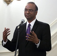 Minister Sridharan Madhusudhanan welcoming the guests and introducing the cultural event "'New World Raga' - Communicating Across Musical Cultures" presented by Embassy of India, Washington DC on April 22.