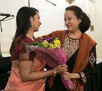 Presentation of bouquet to artist Reena Esmail by Dr. Maina Chawla Singh, Scholar-in-Residence, School of International Service, American University.