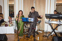 Singers Mr. Vidyasager and Ms Urmila Prasad of 'Tarang Music Group' singing songs during a cultural program at Celebration of Eid-ul-Fitr function at Embassy Residence on August 8, 2015. They are accompanied by Mr. Tamesh Surujpaul on Synthesizer Keyboards, by Mr. Himu Rozario on Tabla and by Mr. Aditya Nimkar on Drum Set.
