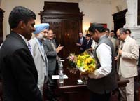 Presentation of bouquet to Dr. M. Annadurai, Director, ISRO Satellite Center" at the Embassy of India, Washington, DC on August 24.