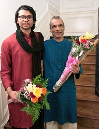 Artists of 'Colors of Breath: A Meditative Thematic Music Recital' (from left to right) Anirudh Changkakoti and Deepak Ram after being presented with bouquets.