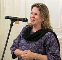 Ms. Carrie Trybulec, Director, Gandhi Memorial Centre, emceeing the cultural event 'Colors of Breath: A Meditative Thematic Music Recital', presented by Embassy of India, Washington DC on April 29.