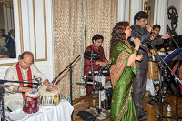 Singers Mr. Vidyasager and Ms Urmila Prasad of 'Tarang Music Group' singing songs during a cultural program at Celebration of Eid-ul-Fitr function at Embassy Residence on August 8, 2015. They are accompanied by Mr. Tamesh Surujpaul on Synthesizer Keyboards, by Mr. Himu Rozario on Tabla and by Mr. Aditya Nimkar on Drum Set.