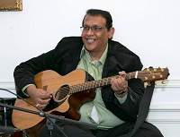 Moses playing the Guitar