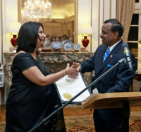 Rajan  Natarajan, Deputy Secretary of State of Maryland presenting a citation  on behalf of Maryland Governor Martin O&rsquo;Malley to Ambassador Nirupama  Rao.