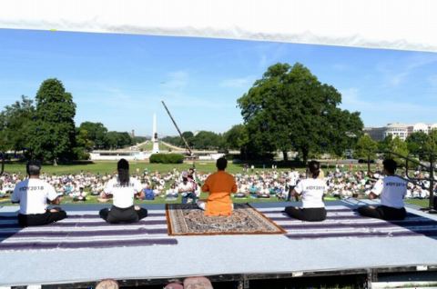 Yoga demonstrators led by Dr. Moxraj and the gathering doing Yoga at the 4th International Day of Yoga organized by the Embassy of India in partnership with Friends of Yoga at the US Capitol in Washington, DC on June 16, 2018