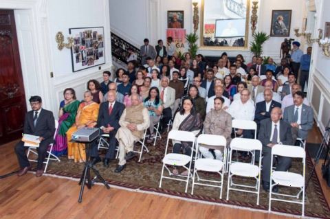 Guests in attendance watching the video screening of Prime Minister leading Yoga on June 21, 2018 at 4th International Day of Yoga Celebrations at the Embassy of India on Thursday, June 21, 2018.