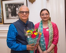 Ms. Karamjeet Kaur, Third Secretary, presenting a bouquet of flowers to Shri Rajiv Malhotra, speaker, at the cultural event titled "A Walk Through The Artist's Mind" presented by the Embassy of India, Washington, DC, at the Embassy premises on Friday, May 5, 2017.