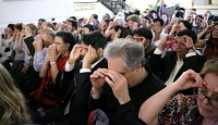 Guests participating in a brief meditation session.