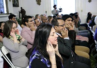 Guests participating in a brief meditation session.