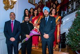 Ambassador Sarna presenting a bouquet to Rev. Fr. Laby George Panakkamattom.