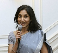 Emcee Ms. Anuradha welcoming the guests and introducing the event - with Anuradha Nehru.
