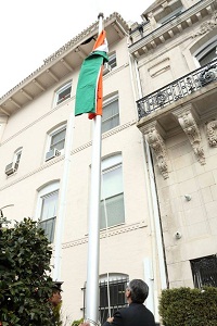 Ambassador Arun K. Singh unfurling the National Flag, followed by singing of the National Anthem.