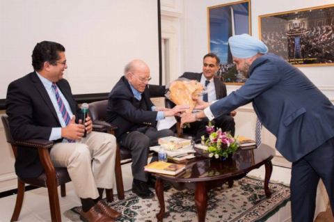 Ambassador Navtej Sarna presenting bouquet to the author at Author Talk and Book Signing Event by Dr. Kamal Verma at Embassy of India on January 19, 2018